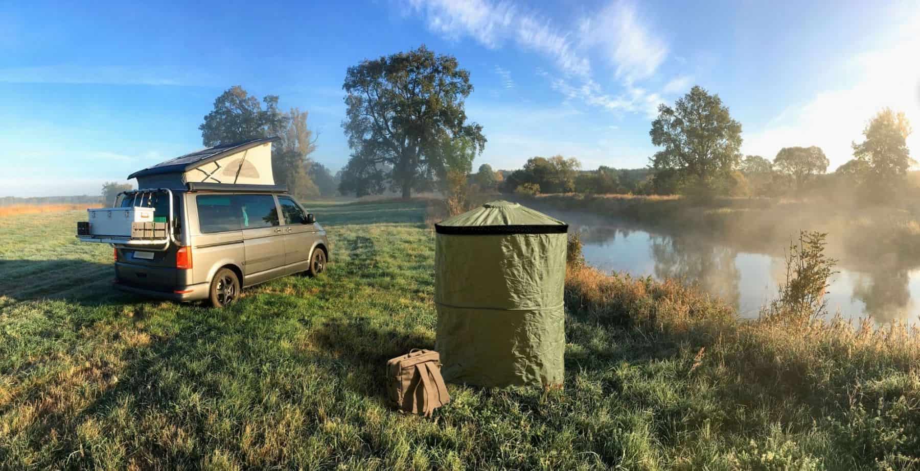 Instaprivy by a lake with a camper van